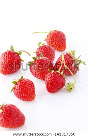 Fresh ripe red strawberries, isolated on white background with soft shadow.