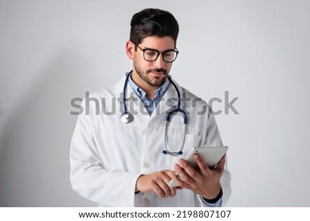 Similar – Image, Stock Photo doctor man working on laptop. Corona virus test on table. Covid-19 concept