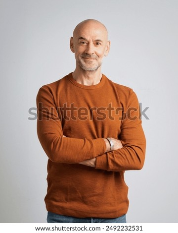 Similar – Image, Stock Photo Portrait of mature man with grey beard exploring Finland in winter. Traveler with camera on the top of rock. Beautiful view of northern landscape with frozen Baltic Sea and snowy islands.