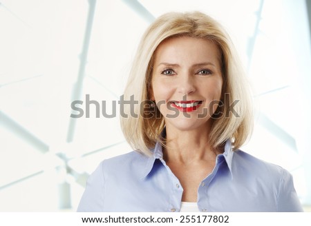 Close-up portrait of beautiful mature woman smiling.