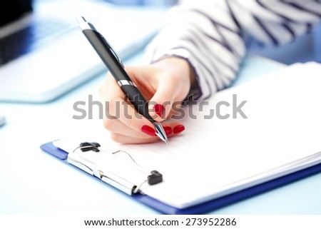 Close-up portrait of financial administrator sitting at office while signing the contract.