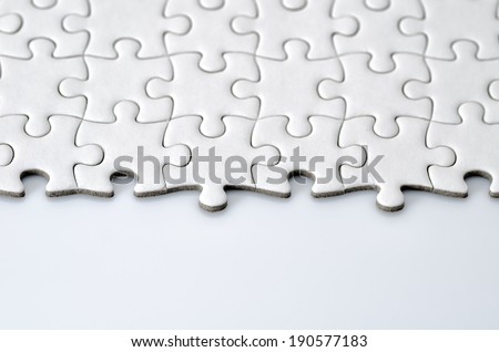 Plain white jigsaw puzzle. (isolated on white background.)