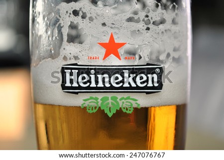 GENEMUIDEN, THE NETHERLANDS, 26 JANUARY 2015 - Beer glass with beer and the Heineken logo and word brand.