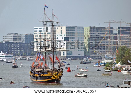 AMSTERDAM, THE NETHERLANDS, 19 AUGUST 2015 - Old tall ships sailing into the Port of Amsterdam during Sail 2015.