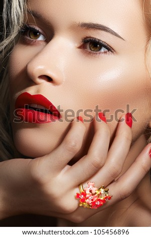 Cosmetics, accessories and romantic retro style. Sexy beautiful blonde female model with fashion make-up, sexy evening red lips makeup, bright nails with polish manicure and big cocktail ring