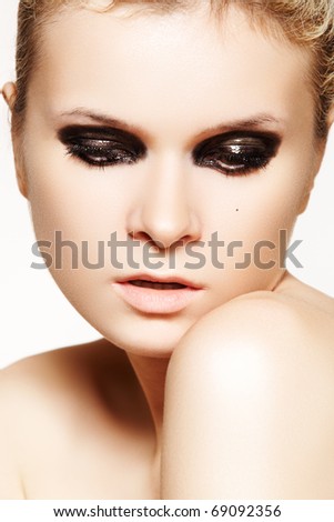 Fashion young girl with dark gloss make-up. Rock, halloween and gothic style. Close-up portrait