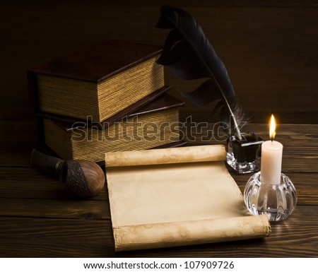 old papers and books on a wooden table
