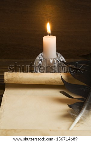 Old paper with a candle