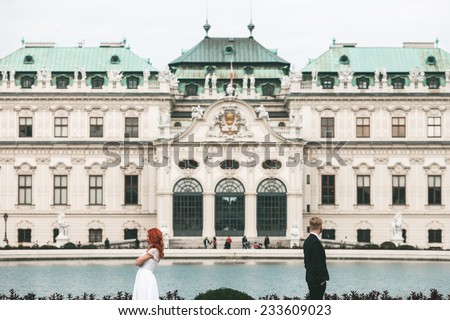 Wedding couple on a walk in the estate of the Belvedere in Vienna