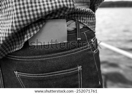 Lower Body  of Men dressed in selvedge jeans , retro shoes and plaid shirt. Vintage look
