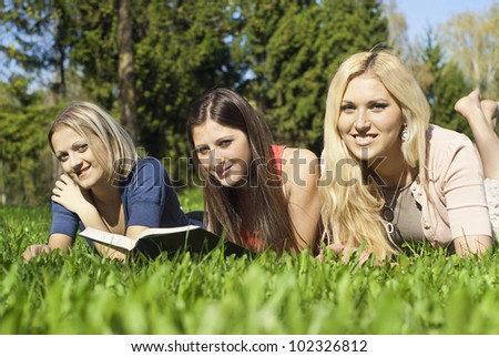 beautiful girl in the nature reading a book