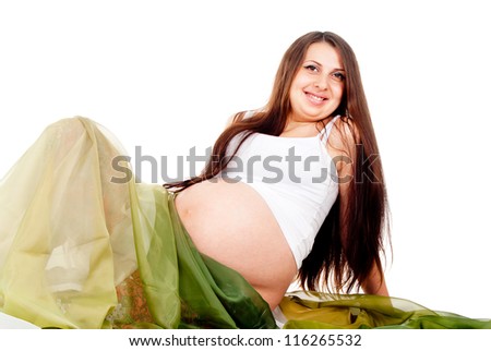 a pregnant girl in a green veil isolated on white background