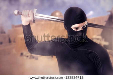 Close up portrait of male Ninja with sword outdoor  in smoke