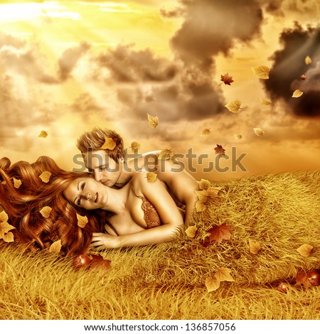 Fantasy romantic collage. Loving fairy couple  lying in bed of yellow grass, leaves outdoor in autumn sunset. Tender Lovers have sex