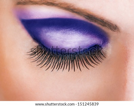 Close-up of closed beautiful eye with long sexy false lashes