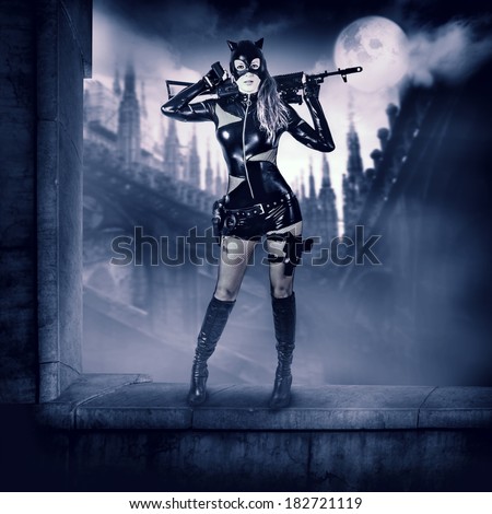 Fantasy. Military sexy woman sniper  in latex cat suit holding automatic