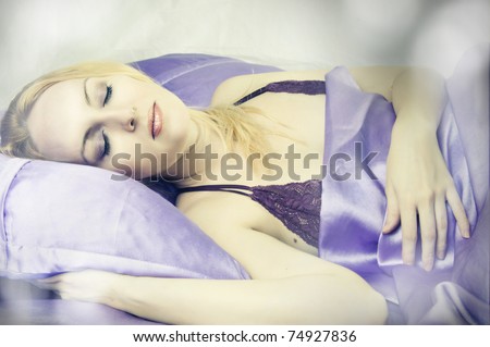 Sleeping beauty woman in silk Bed alone closeup in morning
