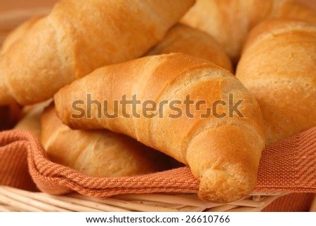 Freshly baked homemade crescent rolls in a cloth lined basket