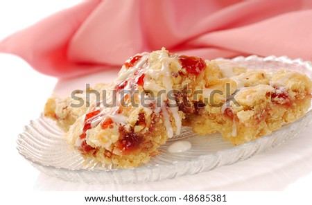 Freshly baked strawberry pecan nut bars with vanilla icing