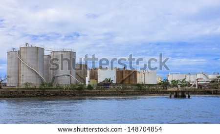 BANGKOK, THAILAND - JULY 12: Oil Storage Tanks, Thailand on July 12, 2013. Oil storage along side the Chao Phraya River have played supported role for industrial sites in Bangkok.