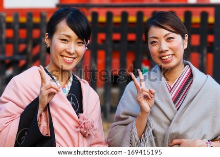 MIYAJIMA, JAPAN - NOVEMBER 15: Japanese People in Miyajima, Japan on November 15, 2013. Unidentified Japanese women dress up Kimono to pay respect to the Toyokuni Shrine
