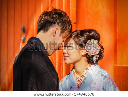 KYOTO, JAPAN - NOVEMBER 18: Japanese Couple in Kyoto, Japan on November 18, 2013. Unidentified groom and bride dress traditional costume for their wedding ceremony
