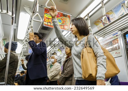 KYOTO, JAPAN - OCTOBER 21: Subway Commuter in Kyoto, Japan on October 21, 2014. Unidentified Japanese subway commuters catch a train to work in the morning