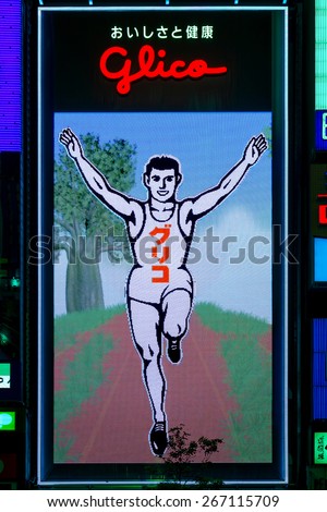 OSAKA, JAPAN - OCTOBER 24: Glico Man in Osaka, Japan on October 24, 2014. Replacing the old neon lights, the 6th gen. of the billboard uses 140,000 LED in total, allows new animated background scenes