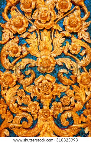 Low Relief of Thai Pattern Style on the Wall in a Thai Temple