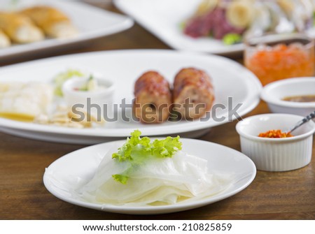 Fresh Vietnamese style food set , Grilled pork with vegetables and wrapping flour