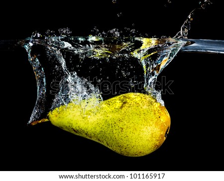 fresh pear dropping into water