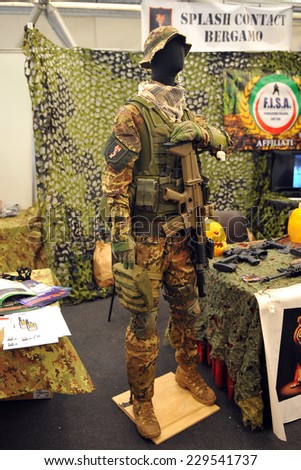MILAN, ITALY - NOV 1: Uniform,  Exhibitor sitting in his stand at Militalia, exhibition dedicated to militaria collectors and military associations on November 1, 2014 in Milan.