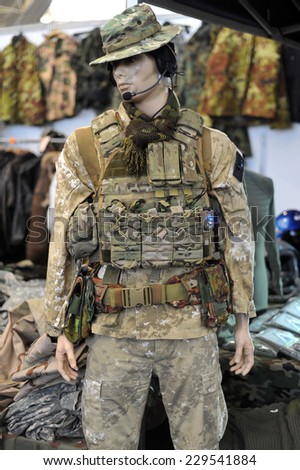 MILAN, ITALY - NOV 1:Uniform,  Exhibitor sitting in his stand at Militalia, exhibition dedicated to militaria collectors and military associations on November 1, 2014 in Milan.