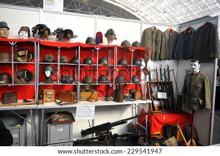 MILAN, ITALY - NOV 1: Exhibitor sitting in his stand at Militalia, exhibition dedicated to militaria collectors and military associations on November 1, 2014 in Milan.