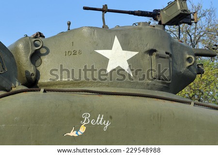 MILAN, ITALY - NOV 1: Old military tank, Exhibitor sitting in his stand at Militalia, exhibition dedicated to militaria collectors and military associations on November 1, 2014 in Milan.