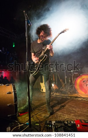 SEATTLE - JULY 21:  Rock guitarist and singer Jordan Cook aka Reignwolf performs on stage at Neumos during the Capitol Hill Block Party in Seattle, WA on July 21, 2012.
