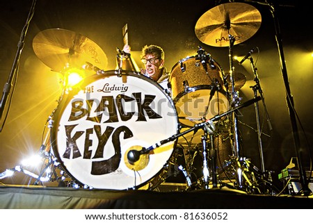 SEATTLE - DEC 8:  Black Keys Drummer Patrick J. Carney plays drums on stage in front of a sold out crowd at Wamu Theater during the Deck the Hall Ball on December 8, 2010 in Seattle, Washington.