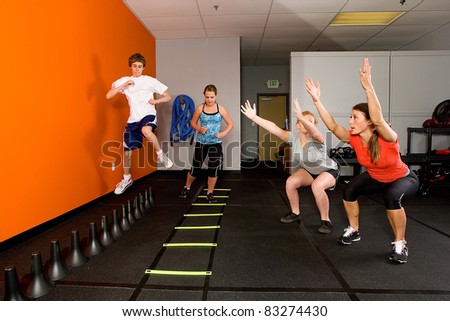 Teenagers working out together in a gym