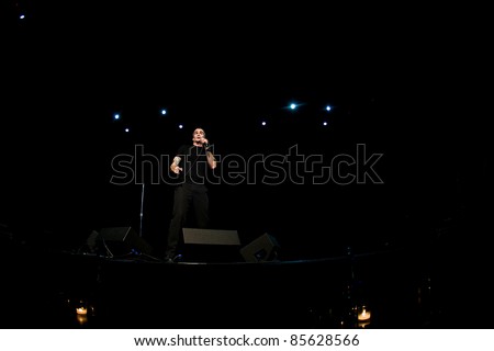 SEATTLE - APRIL 6:   Spoken word artist, rock star, singer, movie star, actor, poet, activist Henry Rollins speaks on stage at the Triple Door Theater in Seattle, WA on April 6, 2011.
