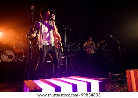 SEATTLE - APRIL 8:  Lead singer Sameer Gadhia of alternative rock band Young the Giant performs on stage at the Moore Theater in Seattle, WA on April 8, 2012.