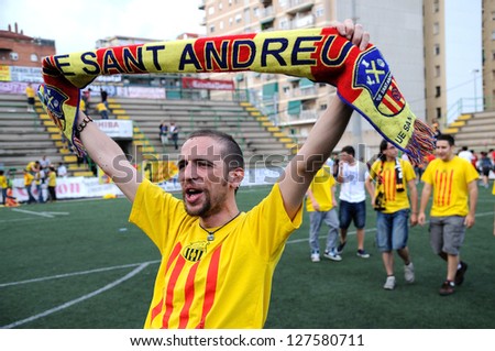 BARCELONA, SPAIN - JUNE 6: U.E. Sant Andreu (foolball club) fans celebrates the victory of his team against Universidad LPGC on June 6, 2010 in Barcelona, Spain. Narcis Sala Stadium.