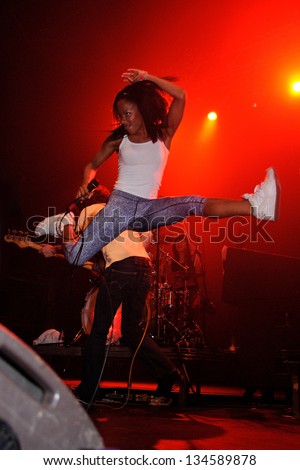 BARCELONA - APR 1: Nkechi Ka Egenamba, known as Ninja,  English rapper and the female lead vocalist for the British indie band The Go! Team, jumps at Razzmatazz on April 1, 2011 in Barcelona, Spain.