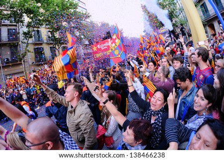 BARCELONA - MAY 13: Thousands of fans of F.C Barcelona football team, celebrates Spanish League La Liga victory in the famous street Rambla Catalunya on May 13, 2013 in Barcelona, Spain.