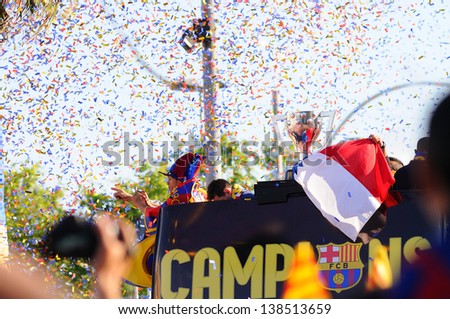 BARCELONA - MAY 13: Adriano Correia, brasilian player of F.C Barcelona football team, celebrates surrounded by confetti, the title consecution of Spanish League on May 13, 2013 in Barcelona, Spain.