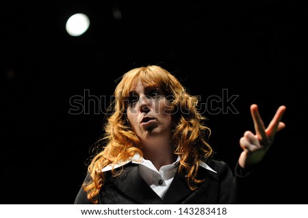 BARCELONA - JAN 13: An actress dressed in executive of the Barcelona Theater Institute, plays in the comedy Shakespeare For Executives on January 13, 2013 in Barcelona, Spain.