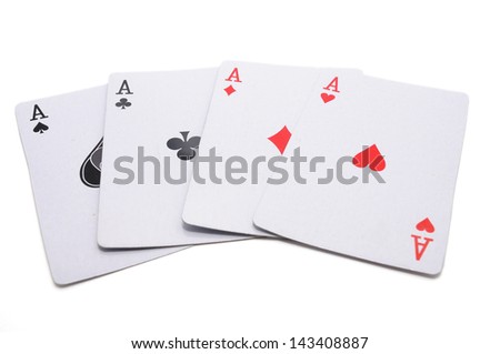 Four aces, including spades, hearts, clubs and diamonds isolated on white background.