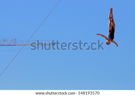 BARCELONA - JULY 30: Cesilie Carlton, jumps from the High Diving Tower at the final of women\'s high altitude jumps at Barcelona Swimming World Championship on July 30, 2013 in Barcelona, Spain.