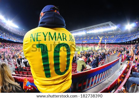 BARCELONA - MAR 12: A man with a Neymar Jr. (Neymar da Silva Santos Junior) player shirt of the Brazil team at the Camp Nou Stadium on March 12, 2014 in Barcelona, Spain.