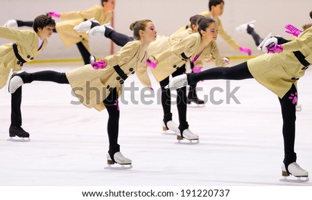 BARCELONA - MAY 03: Young team from a school of skating on ice performs, disguised as detectives with raincoats, at the International Cup Ciutat de Barcelona Open on May 3, 2014 in Barcelona, Spain.