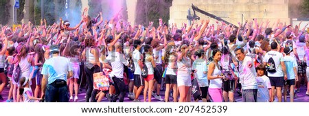 BARCELONA - MAY 18: People at the Holi Color Run Party in the streets of the city on May 18, 2014 in Barcelona, Spain.